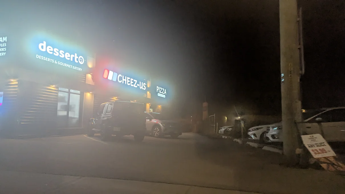 Front of Cheez-Us establishment, obscured by steam fog on camera lens