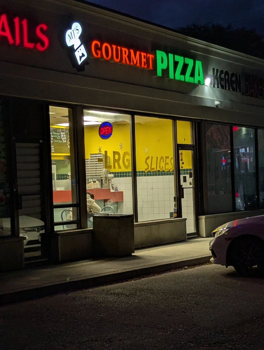 The quaint storefront of MJ's